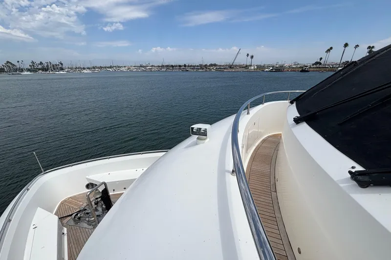 Slide: The Image of Front deck view of 2010 Norseman 80 yacht, overlooking calm waters and distant marina. - 159
