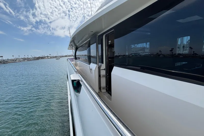 Slide: The Image of Side view of 2010 Norseman 80 yacht on calm water under a partly cloudy sky. - 160