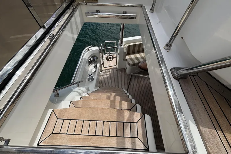 Slide: The Image of Staircase on Norseman 80 yacht, 2010 model, leading to lower deck with water view. - 162