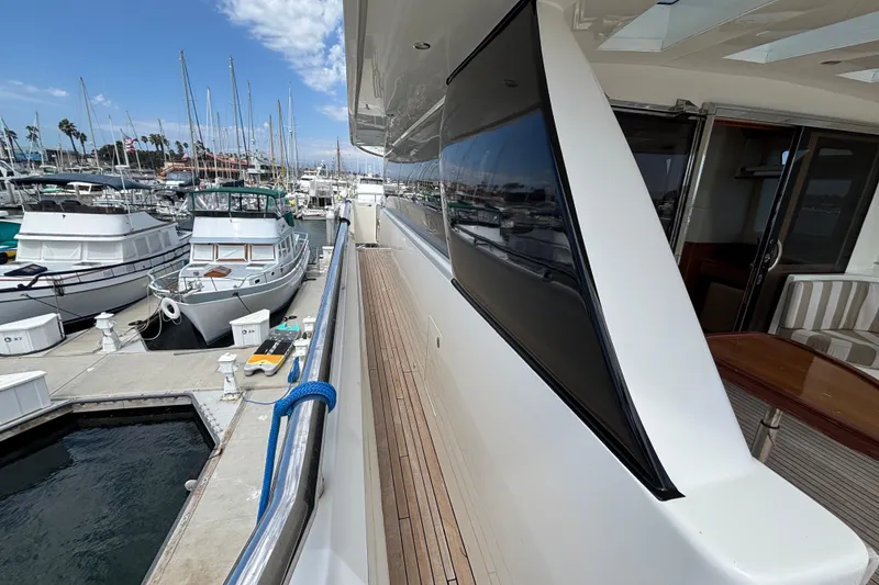 Slide: The Image of Luxury 2010 Norseman 80 yacht docked at marina with clear blue sky. - 164
