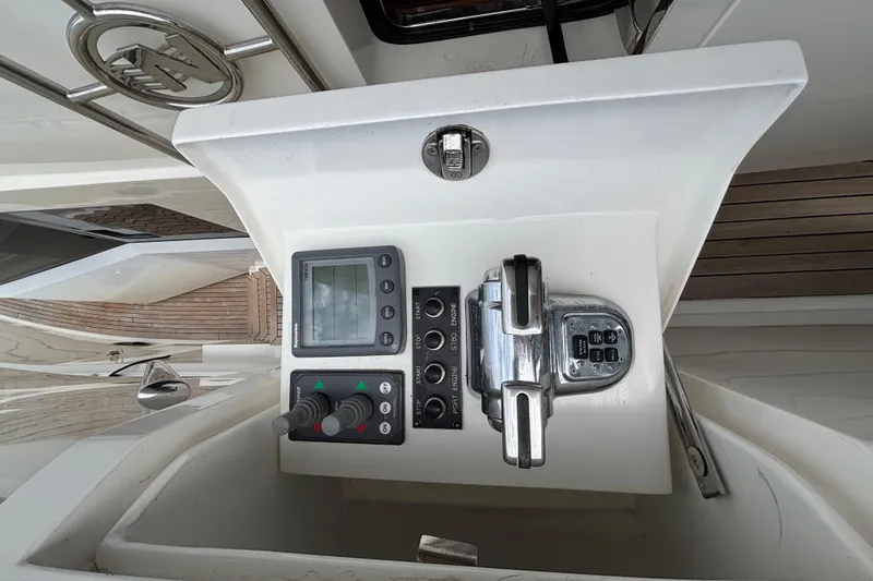 Slide: The Image of Control panel of a 2010 Norseman 80 yacht with navigation and throttle controls. - 168