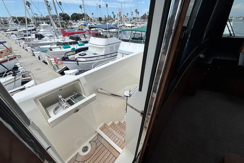 Slide: The Image of Norseman 80 yacht, 2010 model, docked at marina with visible control panel and stairs. - 169