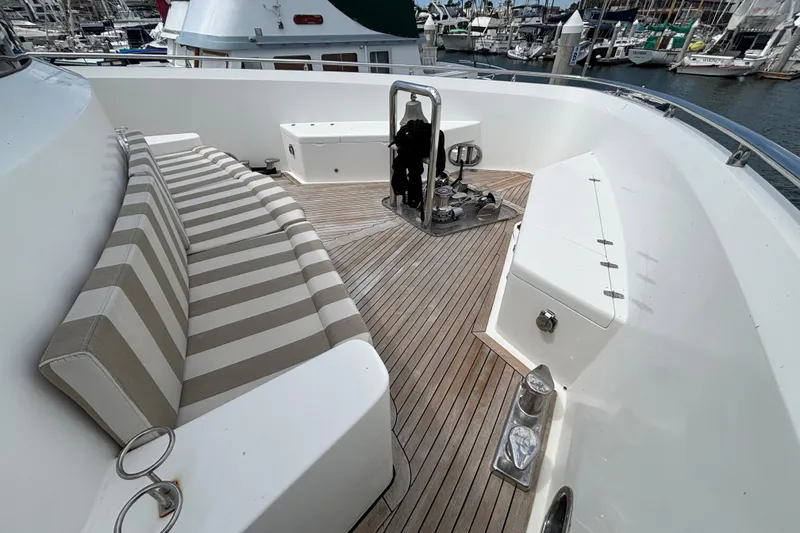 Slide: The Image of Deck of 2010 Norseman 80 yacht with striped seating and wooden flooring. - 178