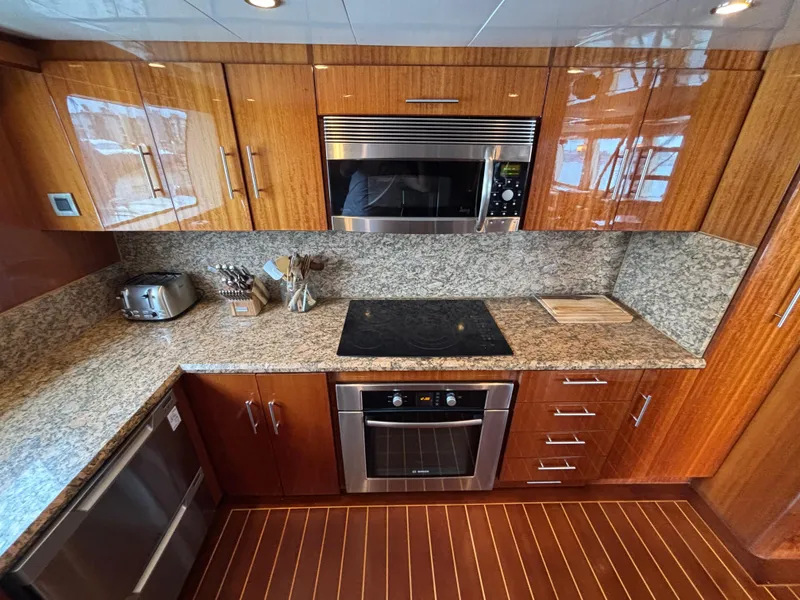 Slide: The Image of Luxurious Norseman 80 yacht kitchen with granite countertops and modern appliances, 2010 model. - 18
