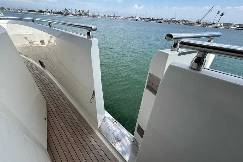 Slide: The Image of Side deck of 2010 Norseman 80 yacht with wooden flooring and stainless steel railings. - 187