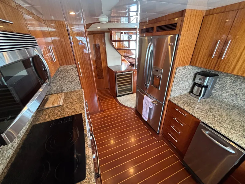 Slide: The Image of Luxurious kitchen interior of 2010 Norseman 80 yacht with modern appliances and wood finishes. - 19