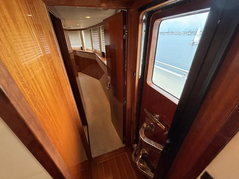 Slide: The Image of Interior view of 2010 Norseman 80 yacht with wooden finishes and ocean view. - 23