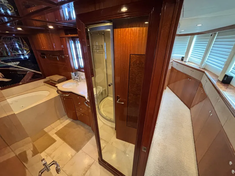Slide: The Image of Luxurious bathroom interior on a 2010 Norseman 80 yacht, featuring wood finishes and modern amenities. - 24