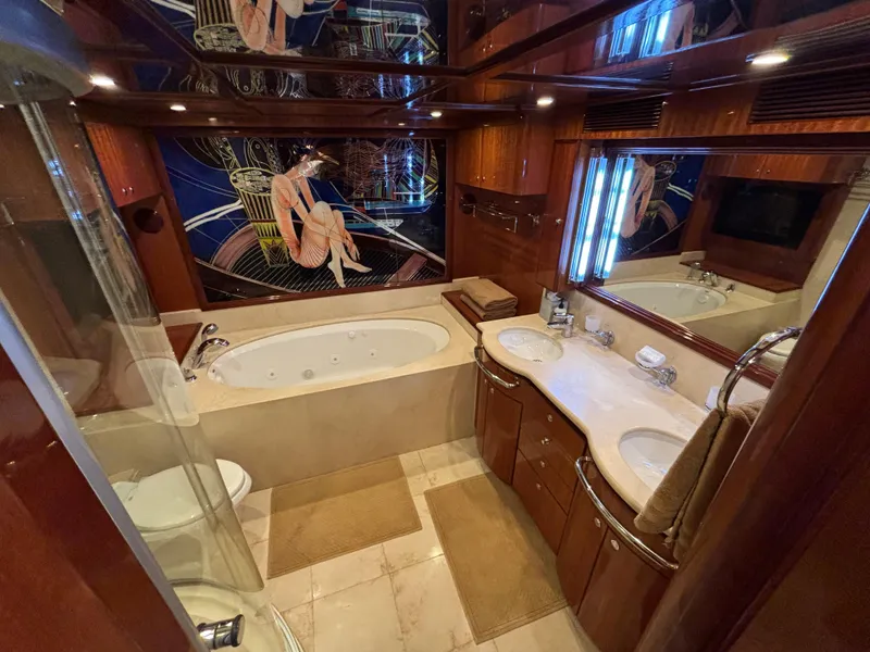 Slide: The Image of Luxurious yacht bathroom with jacuzzi, double sinks, and elegant wood finishes, Norseman 80, 2010. - 25