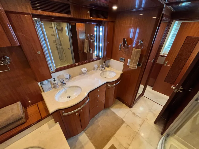 Slide: The Image of Luxurious bathroom in 2010 Norseman 80 yacht with dual sinks and elegant wood finish. - 28