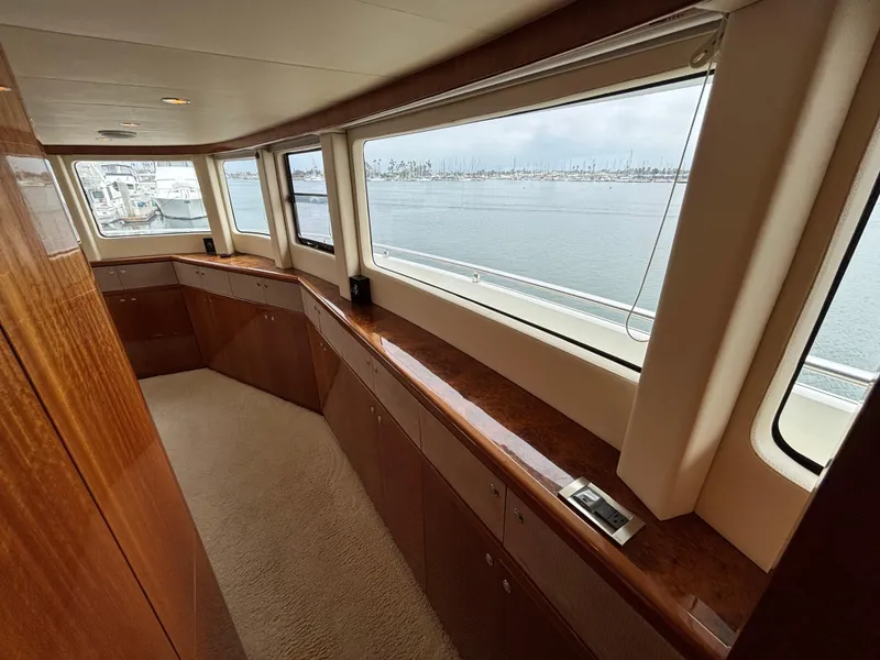 Slide: The Image of Luxurious interior of 2010 Norseman 80 yacht with panoramic windows and wooden cabinetry. - 29