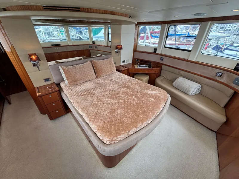 Slide: The Image of Luxurious Norseman 80 yacht bedroom interior with plush bedding and panoramic windows, 2010 model. - 33