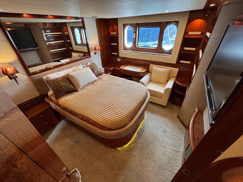 Slide: The Image of Luxurious Norseman 80 yacht bedroom with elegant wood finishes and large windows, 2010 model. - 41