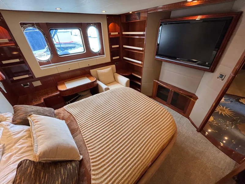 Slide: The Image of Luxurious Norseman 80 yacht bedroom with elegant wood finishes and large windows, 2010 model. - 42