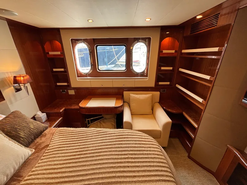 Slide: The Image of Luxurious Norseman 80 yacht interior with cozy seating, elegant wood finishes, and ample shelving. - 43