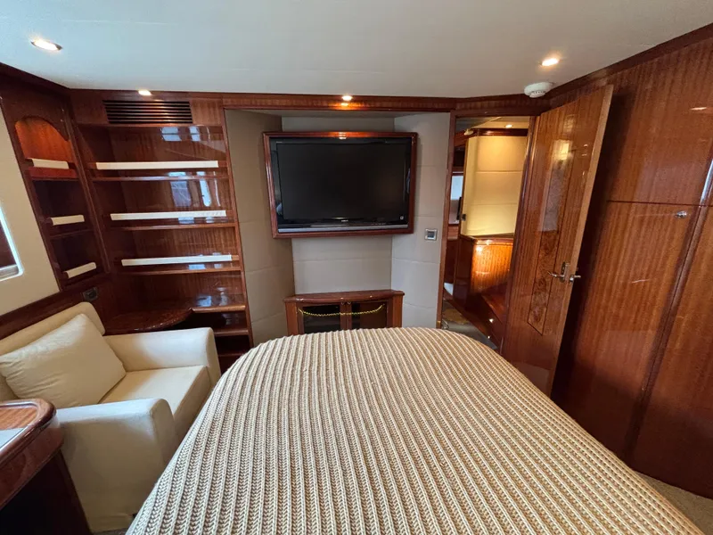 Slide: The Image of Luxurious Norseman 80 yacht interior, featuring elegant wood finishes and a cozy seating area. - 45