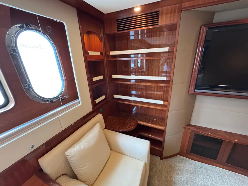Slide: The Image of Luxurious Norseman 80 yacht interior with wood paneling, window, and seating, 2010 model. - 46