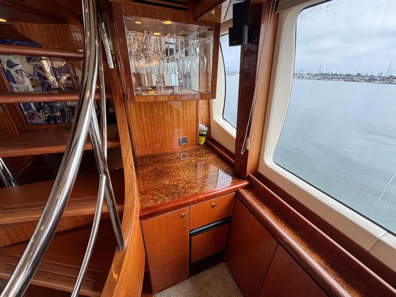 Slide: The Image of Luxurious Norseman 80 yacht interior with wooden cabinetry and ocean view, 2010 model. - 8