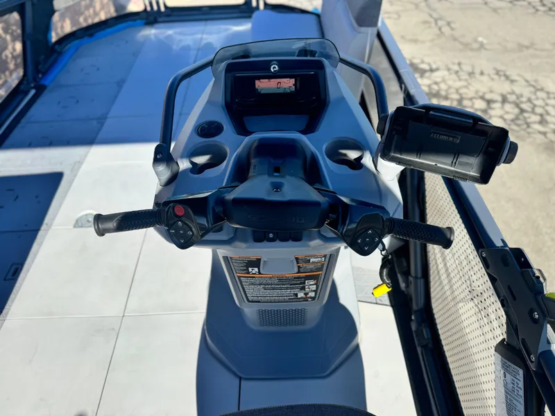 Slide: The Image of 2023 Sea-Doo Switch Cruise 21 dashboard with steering controls and display screen. - 16