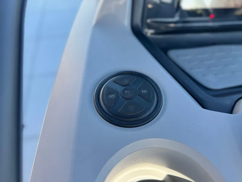 Slide: The Image of Control panel of 2023 Sea-Doo Switch Cruise 21, featuring audio buttons. - 18