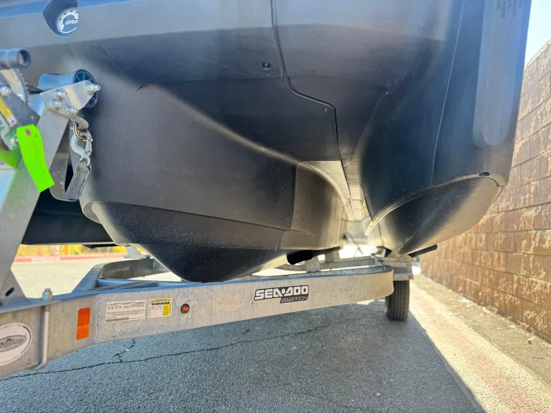 Slide: The Image of 2023 Sea-Doo Switch Cruise 21 on trailer, close-up view of hull and trailer details. - 3