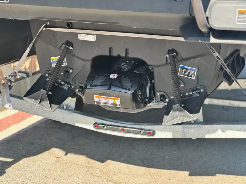 Slide: The Image of 2023 Sea-Doo Switch Cruise 21 rear view showing engine and suspension components. - 7