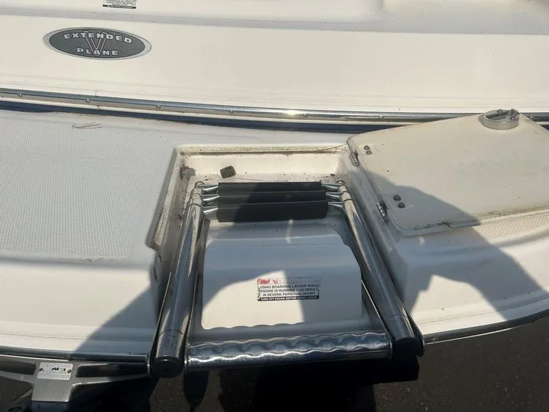 Slide: The Image of 2008 Chaparral 215 SSi boat with extended V-plane and retractable ladder. - 15
