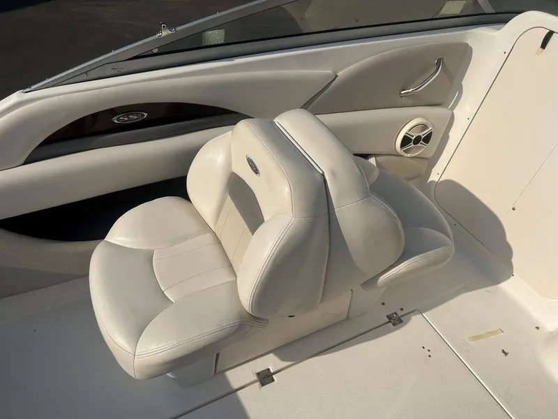 Slide: The Image of 2008 Chaparral 215 SSi boat interior with white leather seating and speaker. - 29