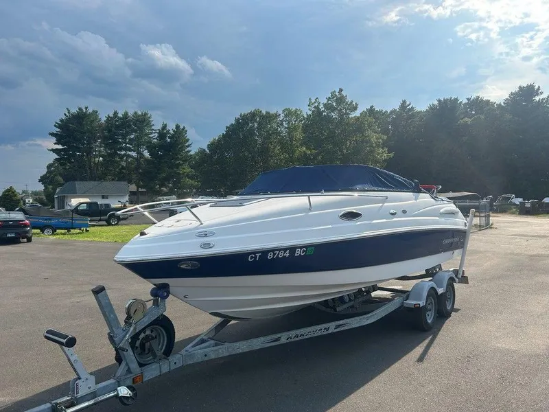 Slide: The Image of 2008 Chaparral 215 SSi boat on trailer, parked outdoors under a cloudy sky. - 3
