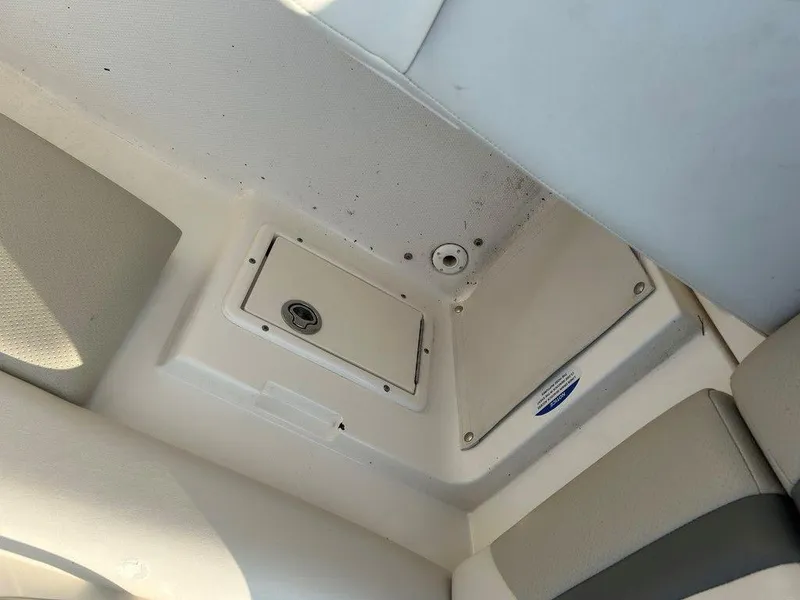 Slide: The Image of Ceiling view of a 2008 Chaparral 215 SSi boat interior, featuring a storage compartment. - 30
