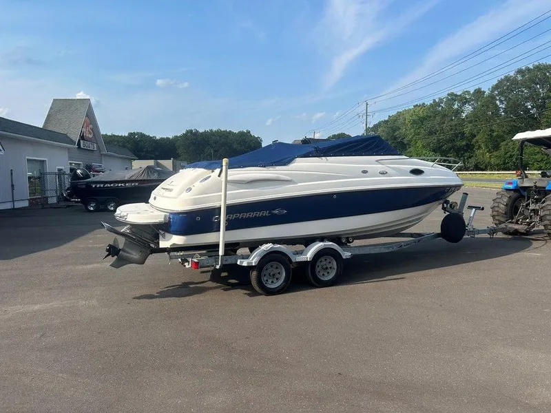 Slide: The Image of 2008 Chaparral 215 SSi boat on trailer, parked outdoors near dealership. - 5