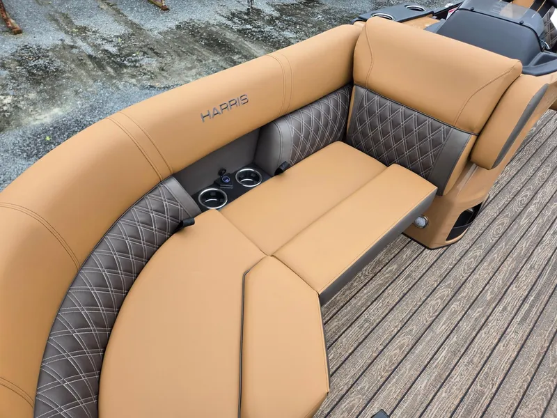 Slide: The Image of Luxurious seating on 2026 Harris Cruiser 210 boat with tan and gray upholstery. - 12