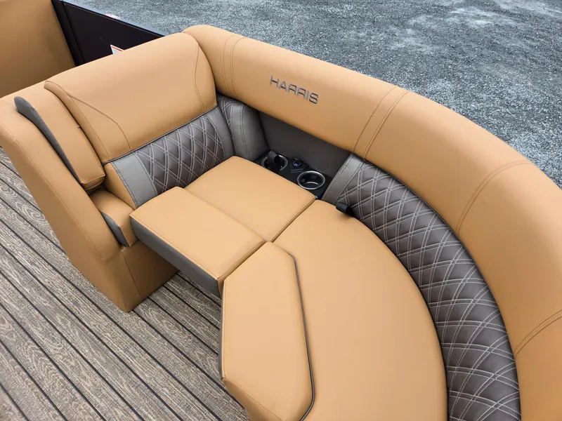 Slide: The Image of Luxurious seating on 2026 Harris Cruiser 210 boat with tan and gray upholstery. - 13