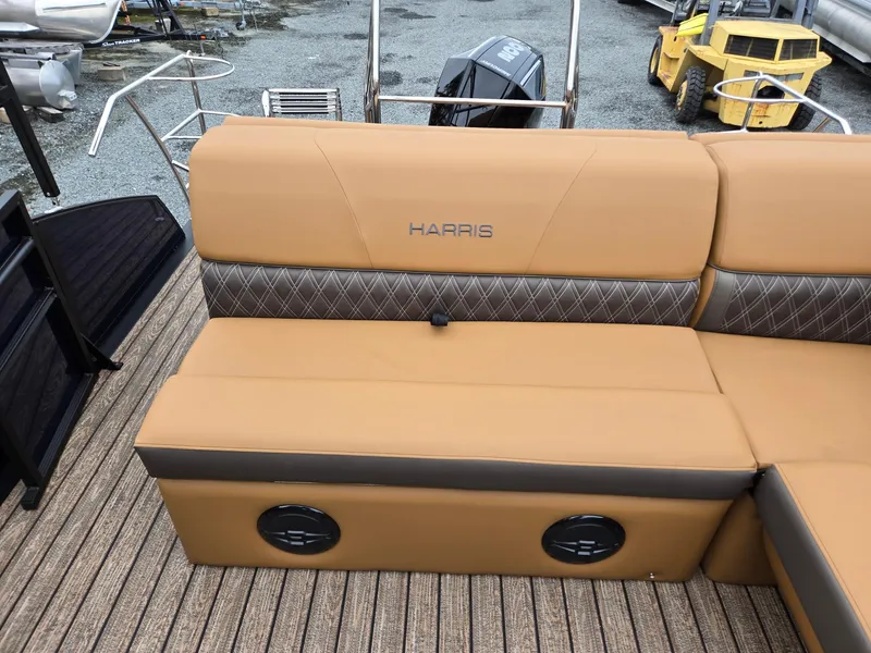 Slide: The Image of 2026 Harris Cruiser 210 boat interior with tan seating and diamond-patterned accents. - 22