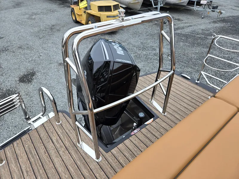 Slide: The Image of 2026 Harris Cruiser 210 boat with Mercury outboard motor, featuring sleek deck and seating. - 25