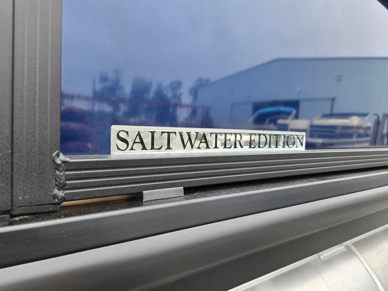 Slide: The Image of 2026 Harris Cruiser 210 Saltwater Edition badge on boat exterior. - 37