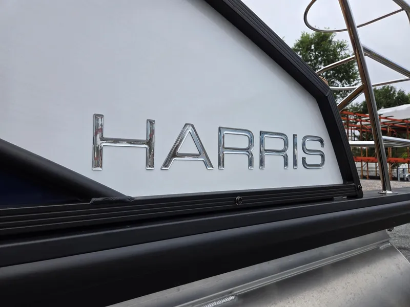 Slide: The Image of 2026 Harris Cruiser 210 boat with chrome lettering detail. - 38