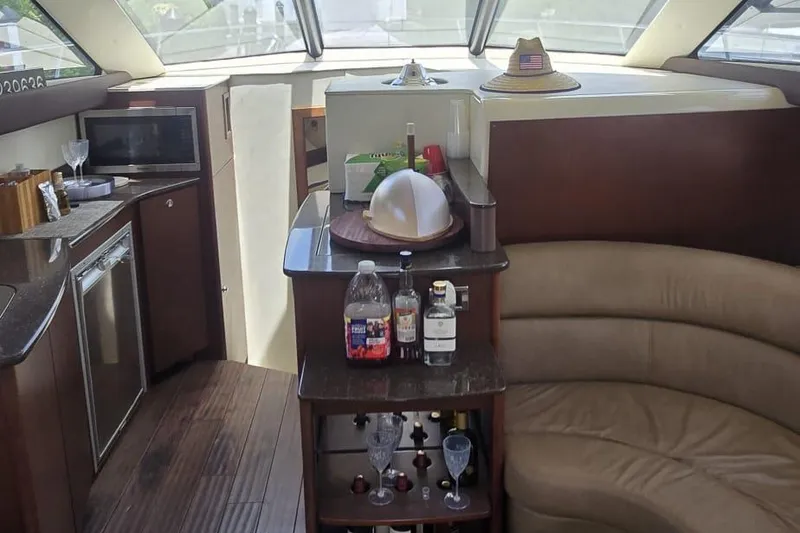 Slide: The Image of Luxurious interior of a 2012 Meridian 341 Sedan yacht with bar and seating area. - 11