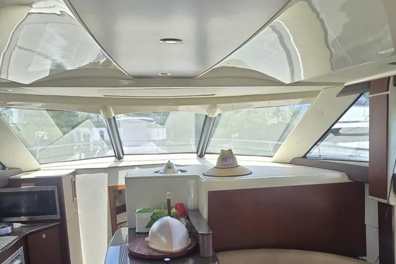 Slide: The Image of Interior of a 2012 Meridian 341 Sedan yacht with modern design and large windows. - 13