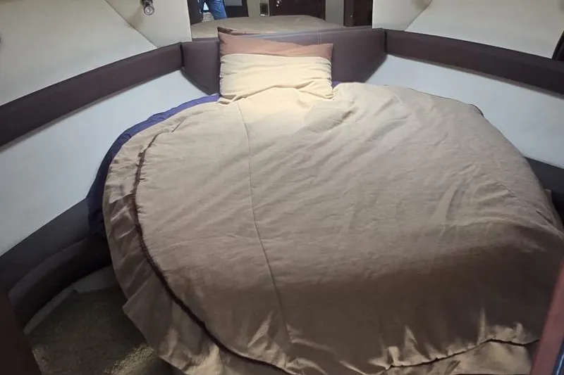 Slide: The Image of Cozy bedroom interior of 2012 Meridian 341 Sedan yacht with round bed. - 19