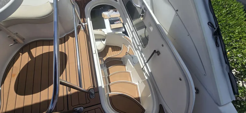 Slide: The Image of 2012 Meridian 341 Sedan boat interior with open hatch and wooden flooring. - 23