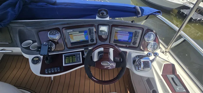 Slide: The Image of Helm of 2012 Meridian 341 Sedan with navigation screens and controls. - 27