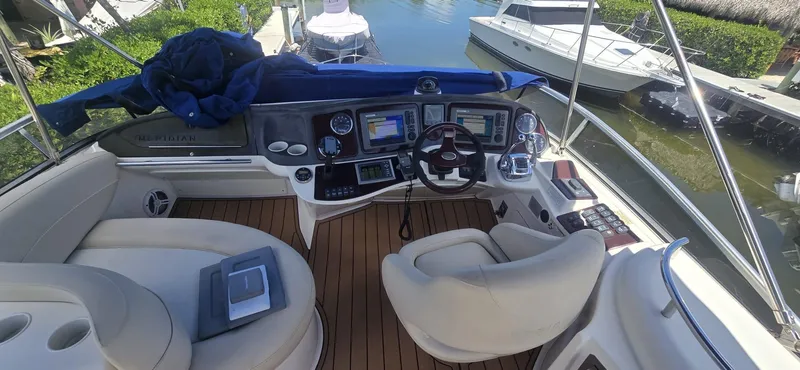Slide: The Image of 2012 Meridian 341 Sedan yacht cockpit with navigation controls and seating. - 28
