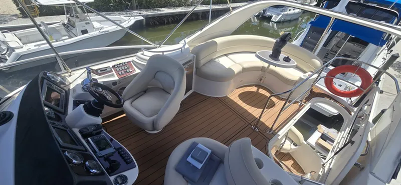 Slide: The Image of Luxurious 2012 Meridian 341 Sedan yacht interior with plush seating and modern helm controls. - 29