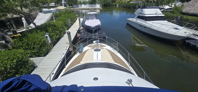 Slide: The Image of 2012 Meridian 341 Sedan docked in a serene marina setting. - 30