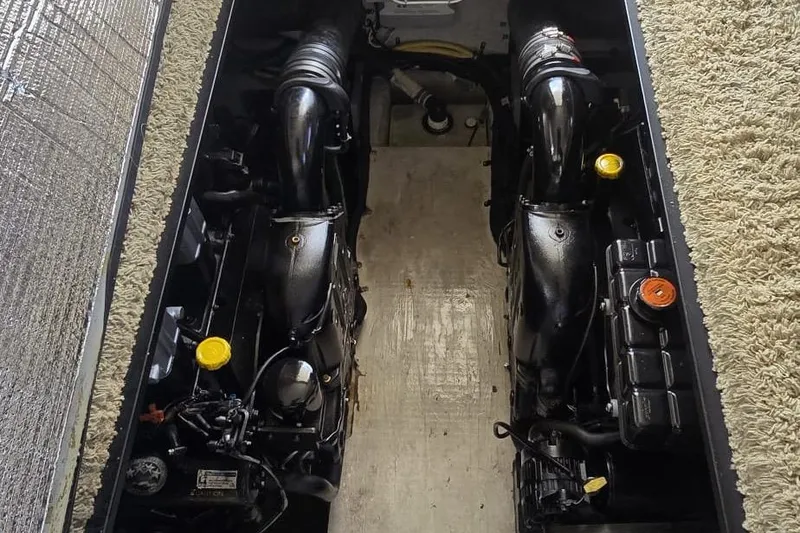 Slide: The Image of Engine compartment of a 2012 Meridian 341 Sedan boat, showcasing dual engines. - 9