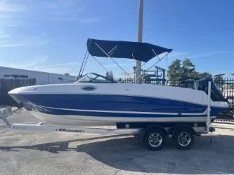 The Image of 2022 Bayliner VR6 boat with blue and white design on a trailer. - 0