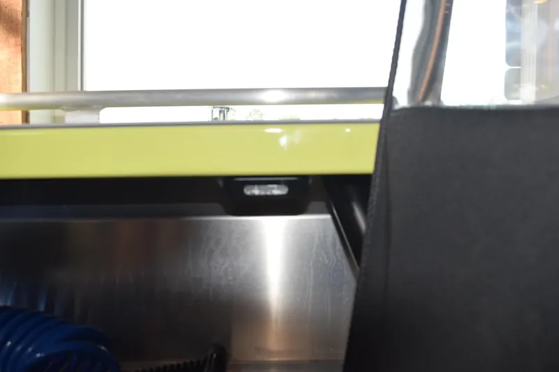 Slide: The Image of Interior detail of 2026 Stabicraft 1550 Fisher Offshore boat, featuring metal and fabric elements. - 12