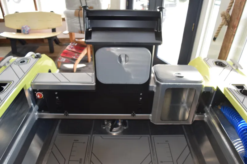 Slide: The Image of 2026 Stabicraft 1550 Fisher Offshore boat interior with storage compartments and seating. - 13