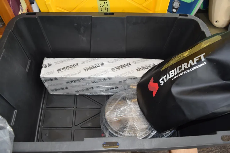 Slide: The Image of Stabicraft 1550 Fisher Offshore 2026 parts in storage box with Ultraflex packaging. - 21
